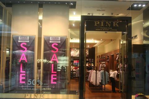 Pink takes the obvious but striking tack with a hot pink on black window display